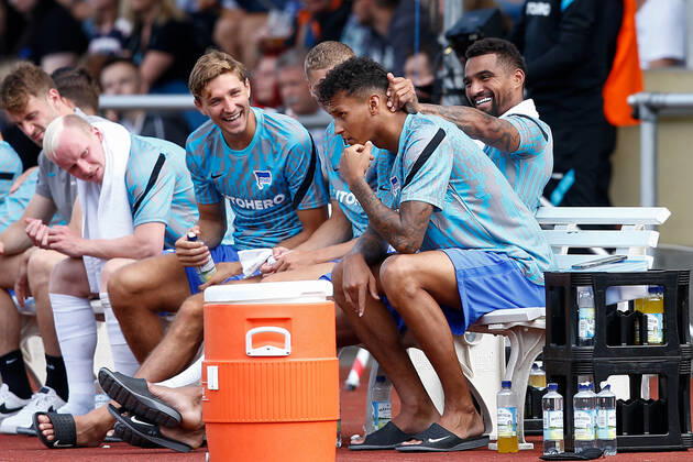 07 07 2021, xtgx, football test match, MSV Neuruppin Hertha BSC Berlin emspor, v l Niklas Stark Hertha, 5 , Marton Dardai Hertha, 31 , Kevin Prince Boateng Hertha, 27 and Davie Selke Hertha, 7 joking on the bench DFL DFB REGULATES PROHIBIT ANY USE OF PHOTOGRAPHS as IMAGE SEQUENCES and or QUASI VIDEO Neuruppin