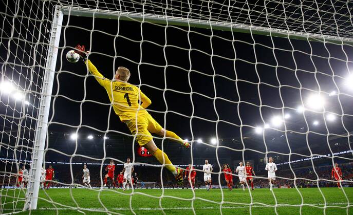Mandatory Credit: Photo by Kieran McManus BPI Shutterstock (9982413bv) Kasper Schmeichel of Denmark dives to save a free kick from Gareth Bale of Wales Wales v Denmark ,UEFA Nations League, League B, Group 4, Football, Cardiff City Stadium, Cardiff, UK - 16 Nov 2018 Wales v Denmark ,UEFA Nations League, League B, Group 4, Football, Cardiff City Stadium, Cardiff, UK - 16 Nov 2018 Copyright: xKieranxMcManus BPI Shutterstockx 9982413bv