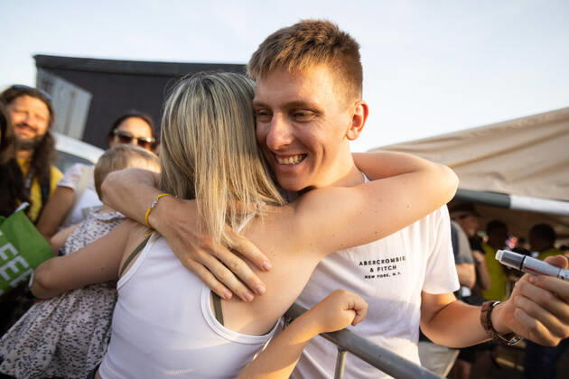 August 13, 2021, Komenda, Slovenia: Two-time Tour de France winner Tadej Pogacar hugs a fan at a reception in his honour in Komenda, his hometown. .Pogacar won the Tour de France for the second time in a row and bronze medal at the Tokyo Olympic Games, Olympische Spiele, Olympia, OS Komenda Slovenia - ZUMAs197 0129347051st Copyright: xLukaxDakskoblerx