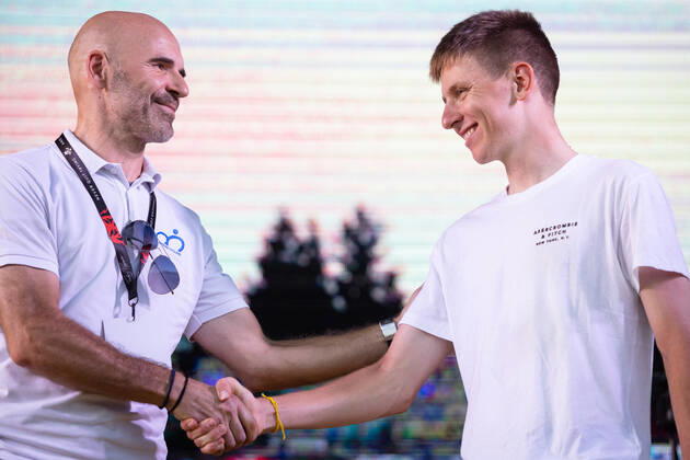 August 13, 2021, Komenda, Slovenia: Two-time Tour de France winner Tadej Pogacar shakes hands with Pavel Mardonovic, head of the Slovenian Cycling Federation, on stage at a reception in his honour in Komenda, his hometown. .Pogacar won the Tour de France for the second time in a row and bronze medal at the Tokyo Olympic Games, Olympische Spiele, Olympia, OS Komenda Slovenia - ZUMAs197 20210813_zaa_s197_173 Copyright: xLukaxDakskoblerx