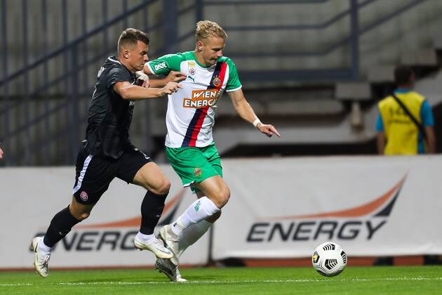 SOCCER - UEFA EL, Luhansk vs Rapid ZAPORIZHIA,UKRAINE,26.AUG.21 - SOCCER - UEFA Europa League play off, Zorya Luhansk vs SK Rapid Wien. Image shows Vladyslav Kochergin (Luhansk) and Marco Gruell (Rapid).  GEPAxpictures xPhilippxBrem