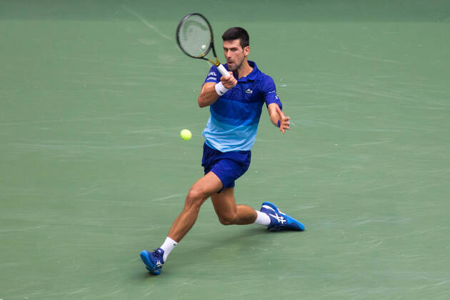 (210913) -- NEW YORK, Sept. 13, 2021 -- Novak Djokovic of Serbia hits a return during the men s singles final between Novak Djokovic of Serbia and Daniil Medvedev of Russia at the 2021 US Open in New York, the United States, Sept. 12, 2021. (Photo by Xinhua) (SP)U.S.-NEW YORK-TENNIS-US OPEN-MEN S SINGLES-FINAL MichaelxNagle 