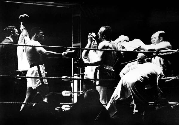 Muhammad Ali is declared the victor after a bloody heavyweight battle with Henry Cooper in London, England., Muhammad Ali, Henry Cooper Wembley Stadium, London, UK, Ref:VM SPO Muhammad Ali Henry Cooper.jpg, Muhammad Ali, Henry Cooper, boxing, heavyweight, knockout, blood, Wembley Stadium, London, UK Copyright: xVarleyxMedia x