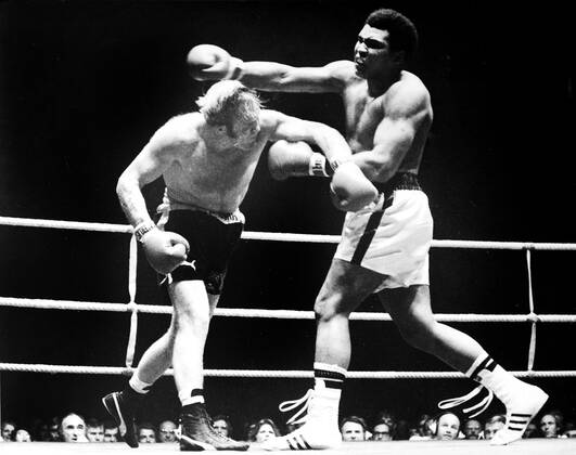 Muhammad Ali is declared the victor after a bloody heavyweight battle with Henry Cooper in London, England., Muhammad Ali, Henry Cooper Wembley Stadium, London, UK, Ref:VM SPO Muhammad Ali Richard Dunn 2.jpg, Muhammad Ali, Henry Cooper, boxing, heavyweight, knockout, blood, Wembley Stadium, London, UK Copyright: xVarleyxMedia x