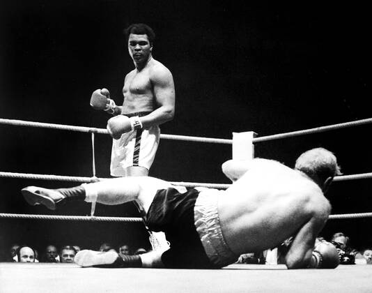 Muhammad Ali is declared the victor after a bloody heavyweight battle with Henry Cooper in London, England., Muhammad Ali, Henry Cooper Wembley Stadium, London, UK, Ref:VM SPO Muhammad Ali Richard Dunn 4.jpg, Muhammad Ali, Henry Cooper, boxing, heavyweight, knockout, blood, Wembley Stadium, London, UK Copyright: xVarleyxMedia x
