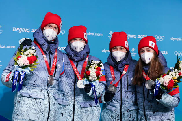 ZHANGJIAKOU, CHINA - FEBRUARY 8, 2022: Silver medallists Irma Makhinya, Danil Sadreyev, Irina Avvakumova and Yevgeny Klimov of Team ROC (L-R) show their medals during the victory ceremony for the mixed team normal hill (NH) final at the Medal Plaza at the 2022 Winter Olympic Games, Olympische Spiele, Olympia, OS Russian Olympic Committee TASS THIS IMAGE WAS PROVIDED BY A THIRD PARTY. EDITORIAL USE ONLY  TS121F7A