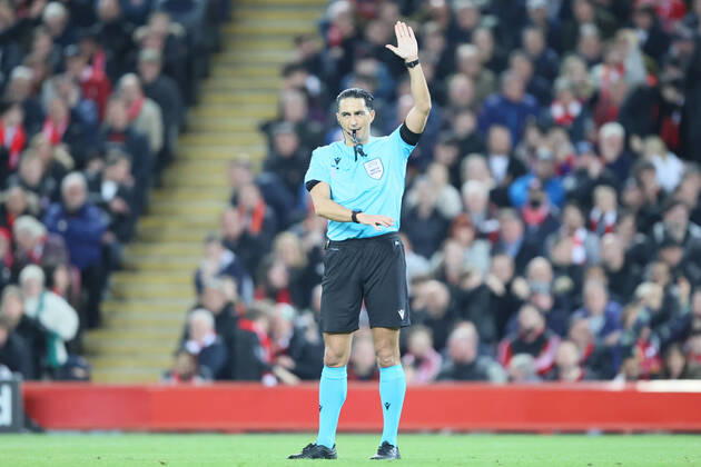 Liverpool v S L Benfica - UEFA Champions League Serdar Gozubuyuk, the match referee, signals offside during the UEFA Champions League match between Liverpool and S L Benfica at Anfield, Liverpool on Wednesday 13th April 2022. Liverpool United Kingdom  Copyright: xMIxNewsx originalFilename:fletcher-liverpoo220413_npz3t