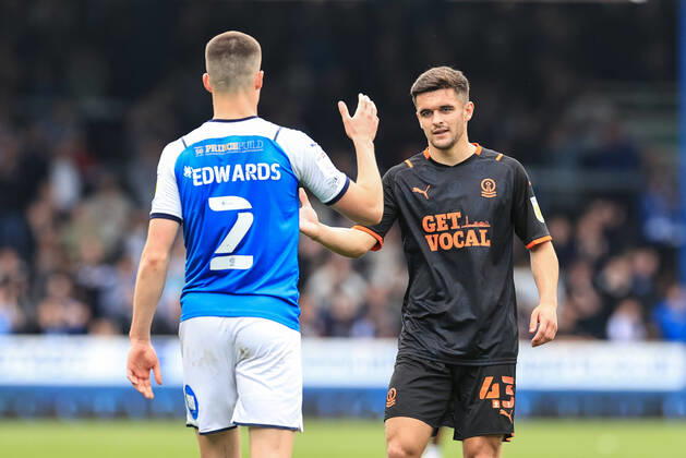 Sky Bet Championship Peterborough v Blackpool Jake Daniels 43 of Blackpool shakes pads with Ronnie Edwards 2 of Peterborough United after the game Peterborough Weston Homes Stadium Cambridgeshire United Kingdom Copyright: xMarkxCosgrove NewsxImagesx