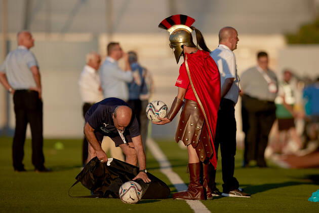 TA QALI, MALTA - 14 JULY 2022 A Hamrun Spartans mascot clad in a Spartan tunic hands over a ball to a club team staff person ahead of the First qualifying round, 2nd leg soccer match, from the UEFA Europa Conference League between Hamrun Spartans and Alashkert at the Centenary Stadium, Ta Qali, Malta on 14 July 2022. Photo Domenic Aquilina Hamrun Spartans FC (MLT) v Alashkert FC (ARM) UECL_22_23