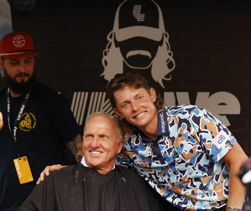 SUGAR GROVE, IL - SEPTEMBER 17: Greg Norman the LIV CEO and golf commissioner poses for a photo with Cameron Smith after he gets a mullet hair cut for charity after the second round of the LIV Golf Invitational Series Chicago on September 17, 2022 at Rich Harvest Farms in Sugar Grove, Illinois. (Photo by Brian Spurlock Icon Sportswire) GOLF: SEP 17 LIV Golf Invitational Series Chicago Icon220917055