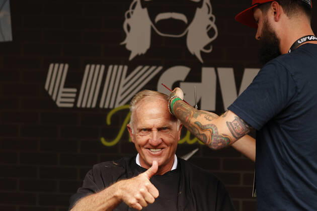 SUGAR GROVE, IL - SEPTEMBER 17: Greg Norman the LIV CEO and golf commissioner gives a thumbs up while getting a mullet hair cut for charity after the second round of the LIV Golf Invitational Series Chicago on September 17, 2022 at Rich Harvest Farms in Sugar Grove, Illinois. (Photo by Brian Spurlock Icon Sportswire) GOLF: SEP 17 LIV Golf Invitational Series Chicago Icon220917063