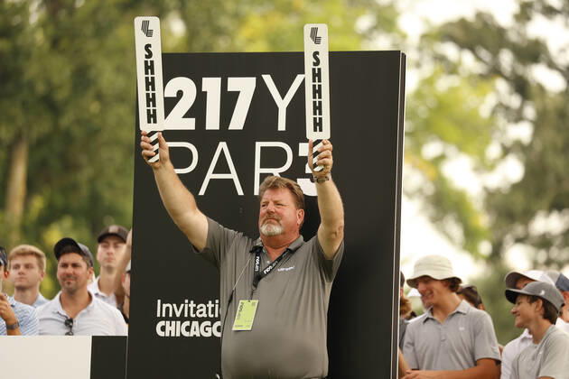 SUGAR GROVE, IL - SEPTEMBER 17: A volunteer holds up signs to be quiet on the 13th tee during the second round of the LIV Golf Invitational Series Chicago on September 17, 2022 at Rich Harvest Farms in Sugar Grove, Illinois. (Photo by Brian Spurlock Icon Sportswire) GOLF: SEP 17 LIV Golf Invitational Series Chicago Icon220917195