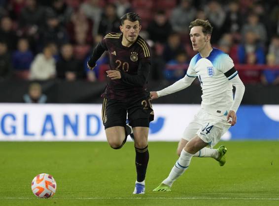 Sheffield, England, 27th September 2022. Lazar Samardzic of Germany and James Garner of England during the International Friendly, Länderspiel, Nationalmannschaft match at Bramall Lane, Sheffield. Picture credit should read: Andrew Yates Sportimage EDITORIAL USE ONLY. No use with unauthorised audio, video, data, fixture lists, club league logos or live services. Online in-match use limited to 120 images, no video emulation. No use in betting, games or single club league player publications. SPI-1910-0027