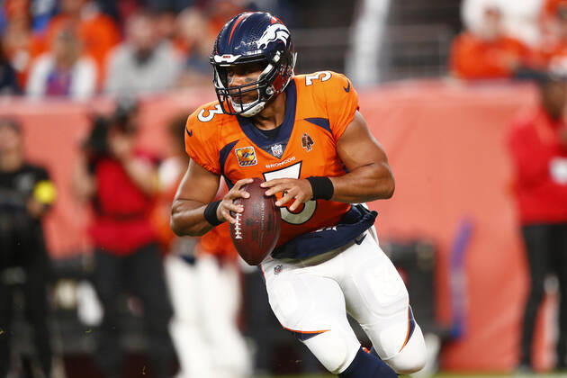 DENVER, CO - OCTOBER 06: Denver Broncos Quarterback Russell Wilson (3) rolls out during and NFL, American Football Herren, USA game between the Indianapolis Colts and the Denver Broncos on October 06, 2022 at Empower Field at Mile High in Denver CO. (Photo by Jeffrey Brown Icon Sportswire) NFL: OCT 06 Colts at Broncos Icon100622027
