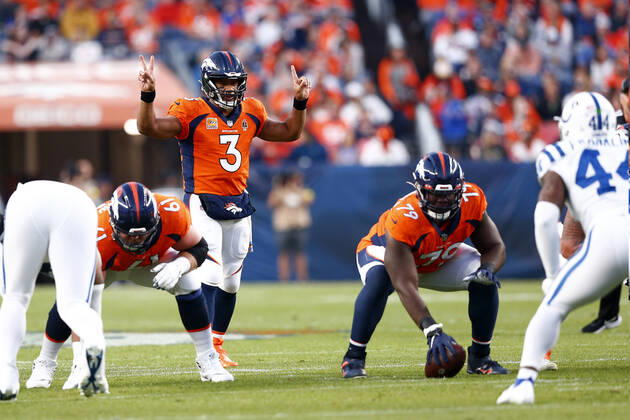 DENVER, CO - OCTOBER 06: Denver Broncos Quarterback Russell Wilson (3) signals to his team during an NFL, American Football Herren, USA game between the Indianapolis Colts and the Denver Broncos on October 06, 2022 at Empower Field at Mile High in Denver CO. (Photo by Jeffrey Brown Icon Sportswire) NFL: OCT 06 Colts at Broncos Icon100622075