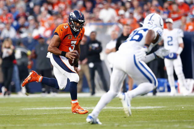 DENVER, CO - OCTOBER 06: Denver Broncos Quarterback Russell Wilson (3) scrambles out of the pocket during an NFL, American Football Herren, USA game between the Indianapolis Colts and the Denver Broncos on October 06, 2022 at Empower Field at Mile High in Denver CO. (Photo by Jeffrey Brown Icon Sportswire) NFL: OCT 06 Colts at Broncos Icon100622076