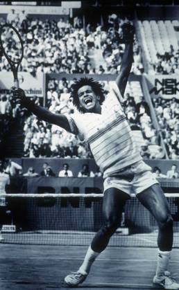 Yannick Noah celebrates during the 1983 French Open at Roland Garros, which he won. Yannick Noah celebrates during the 1983 French Open at Roland Garros, which he won.