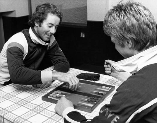 Madonna di Campiglio 1978 12 01 Ingemar Stenmark and Stig Strand pass the time playing backgammon in a rainy Madonna di Campiglio Madonna di Campiglio Italy x24x  Copyright: xKennethxJonasson Expressen TTx INGEMAR STENMARK-STIG STRAND