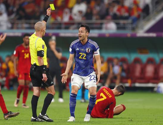 Doha, Qatar, 1st December 2022. Maya Yoshida of Japan receives a yellow card during the FIFA World Cup, WM, Weltmeisterschaft, Fussball 2022 match at Khalifa International Stadium, Doha. Picture credit should read: David Klein Sportimage EDITORIAL USE ONLY. No use with unauthorised audio, video, data, fixture lists, club league logos or live services. Online in-match use limited to 120 images, no video emulation. No use in betting, games or single club league player publications. SPI-2077-0072