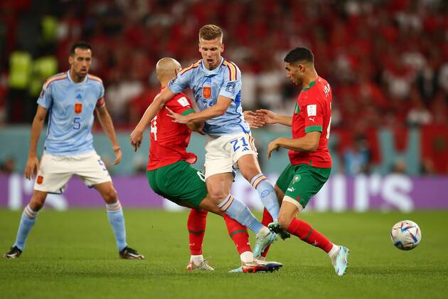 Mandatory Credit: Photo by Michael Zemanek Shutterstock (13651657w) Sofyan Amrabat of Morocco and Achraf Hakimi of Morocco challenge Dani Olmo of Spain. Morocco v Spain, FIFA World Cup, WM, Weltmeisterschaft, Fussball 2022, Round of 16, Football, Education City Stadium, Doha, Qatar - 06 Dec 2022 Editorial Use Only Morocco v Spain, FIFA World Cup 2022, Round of 16, Football, Education City Stadium, Doha, Qatar - 06 Dec 2022 Editorial Use Only  Copyright: xMichaelxZemanek Shutterstockx 13651657w