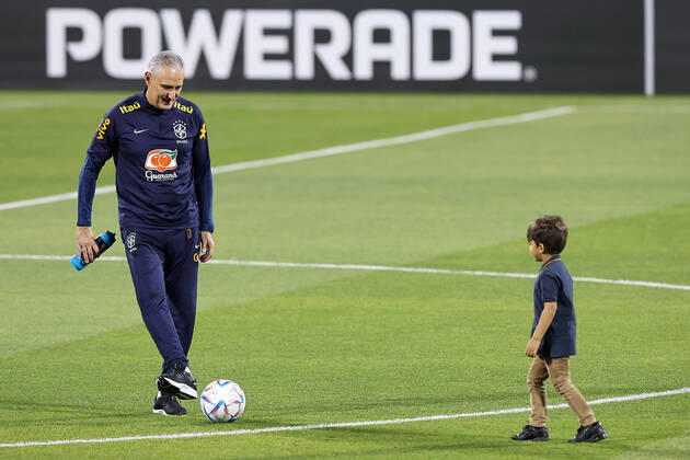 Brazil Training Session - FIFA World Cup, WM, Weltmeisterschaft, Fussball Qatar 2022 Head Coach of Brazil Tite plays with children during Brazil training session at Al Arabi SC Stadium in Doha, Qatar on December 6, 2022. GoranxStanzl PIXSELL