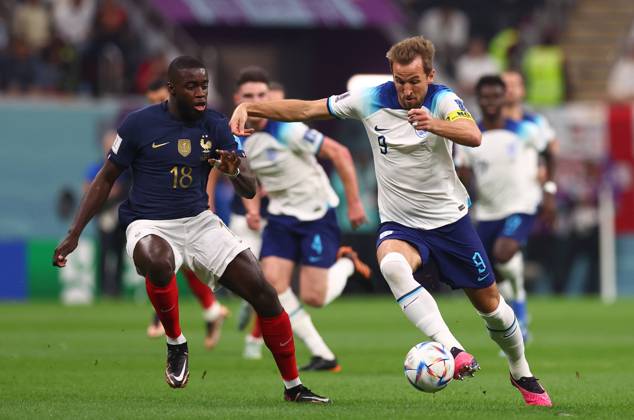 Al Khor, Qatar, 10th December 2022. Harry Kane of England and Dayot Upamecano of France during the FIFA World Cup, WM, Weltmeisterschaft, Fussball 2022 match at Al Bayt Stadium, Al Khor. Picture credit should read: David Klein Sportimage EDITORIAL USE ONLY. No use with unauthorised audio, video, data, fixture lists, club league logos or live services. Online in-match use limited to 120 images, no video emulation. No use in betting, games or single club league player publications. SPI-2092-0057