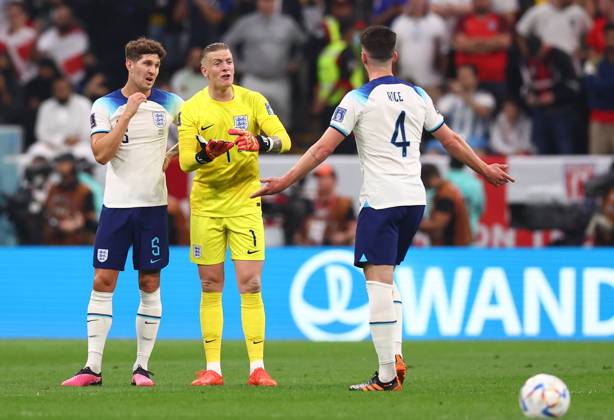 Al Khor, Qatar, 10th December 2022. Declan Rice of England holds an inquest with John Stones of England and Jordan Pickford of England during the FIFA World Cup, WM, Weltmeisterschaft, Fussball 2022 match at Al Bayt Stadium, Al Khor. Picture credit should read: David Klein Sportimage EDITORIAL USE ONLY. No use with unauthorised audio, video, data, fixture lists, club league logos or live services. Online in-match use limited to 120 images, no video emulation. No use in betting, games or single club league player publications. SPI-2092-0063