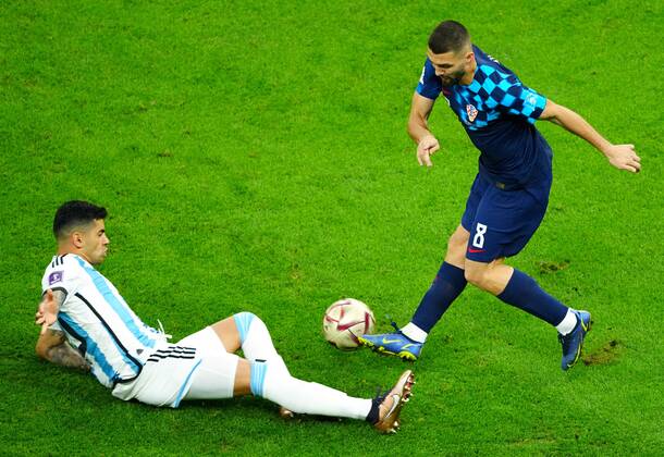 Mandatory Credit: Photo by Javier Garcia Shutterstock (13661834ab) Cristian Romero of Argentina tackles Mateo Kovacic of Croatia Argentina v Croatia, FIFA World Cup, WM, Weltmeisterschaft, Fussball 2022, Semi Final, Football, Lusail Stadium, Al Daayen, Qatar - 13 Dec 2022 Editorial Use Only Argentina v Croatia, FIFA World Cup 2022, Semi Final, Football, Lusail Stadium, Al Daayen, Qatar - 13 Dec 2022 Editorial Use Only  Copyright: xJavierxGarcia Shutterstockx 13661834ab