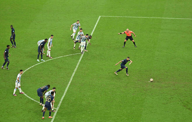 (221218) -- LUSAIER, Dec. 18, 2022 -- Kylian Mbappe (1st R) of France scores with a penalty during the Final between Argentina and France at the 2022 FIFA World Cup, WM, Weltmeisterschaft, Fussball at Lusail Stadium in Lusail, Qatar, Dec. 18, 2022. ) (SP)QATAR-LUSAIL-2022 WORLD CUP-FINAL-ARG VS FRA XiaoxYijiu