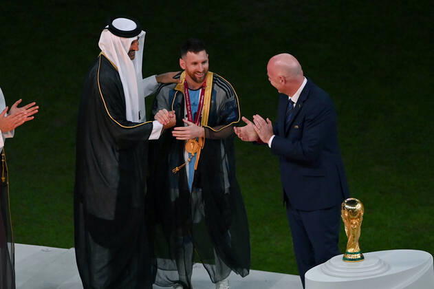 FOOTBALL World Cup 2022 Final Argentina France 18 12 2022 Tamim bin Hamad Al Thani Emir of Qatar puts a cape Bischt around Lionel Messi Fifa President Gianni Infantino shows great enthusiasm