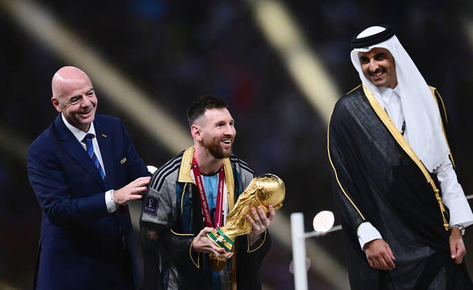 FOOTBALL World Cup 2022 Final Argentina France 18 12 2022 Award Ceremony, CHEER World Champion Argentina FIFA President Gianni Infantino l, Switzerland and the Emir of Qatar, Sheikh Tamir bin Hamad bin Khalifa al Thani r with Lionel Messi with World Cup trophy