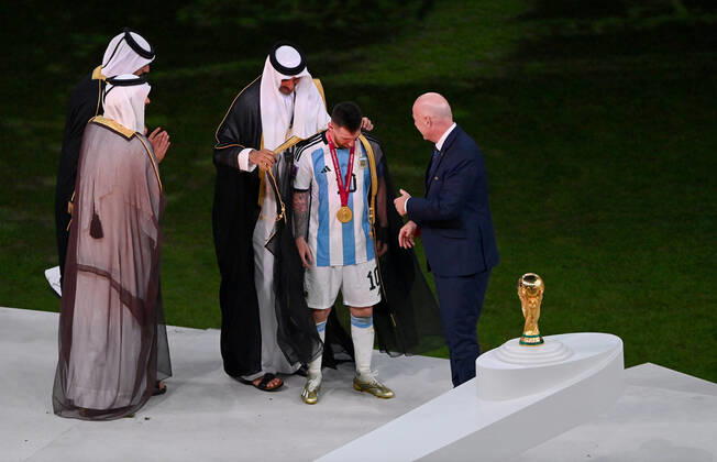 FOOTBALL World Cup 2022 Final Argentina France 18 12 2022 Tamim bin Hamad Al Thani Emir of Qatar puts a cape Bischt around Lionel Messi Fifa President Gianni Infantino shows great enthusiasm