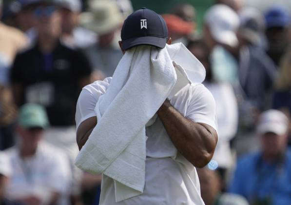Tiger Woods wipes off on the green of the second hole during the first round at the Masters tournament at Augusta National Golf Club in Augusta, Georgia on Thursday, April 6, 2023.  AUG20230406205 JOHNxANGELILLO
