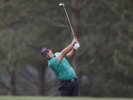 Patrick Reed hits approach shot to the first green during the first round at the Masters tournament at Augusta National Golf Club in Augusta, Georgia on Thursday, April 6, 2023.  AUG20230406241 JOHNxANGELILLO