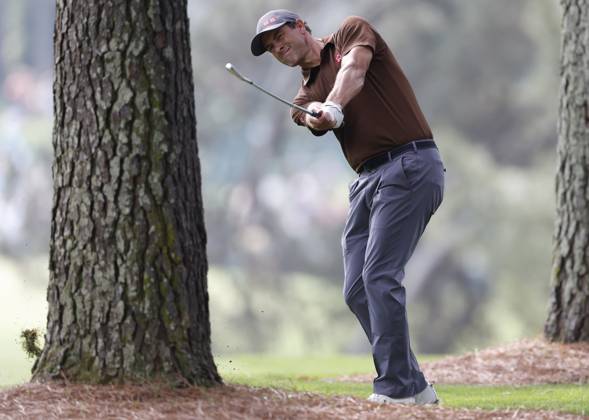 Adam Scott hits from pine straw on first hole during the first round at the Masters tournament at Augusta National Golf Club in Augusta, Georgia on Thursday, April 6, 2023.  AUG20230406246 JOHNxANGELILLO