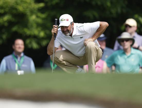 Jose Maria Olazabel studies putt on first hole during the first round at the Masters tournament at Augusta National Golf Club in Augusta, Georgia on Thursday, April 6, 2023.  AUG20230406254 JOHNxANGELILLO