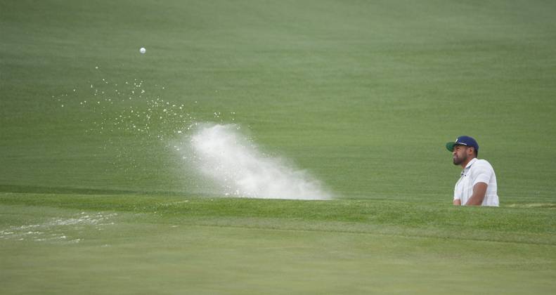 Tony Finau blasts from bunker at the second hole during the first round at the Masters tournament at Augusta National Golf Club in Augusta, Georgia on Thursday, April 6, 2023.  AUG20230406261 BOBxSTRONG