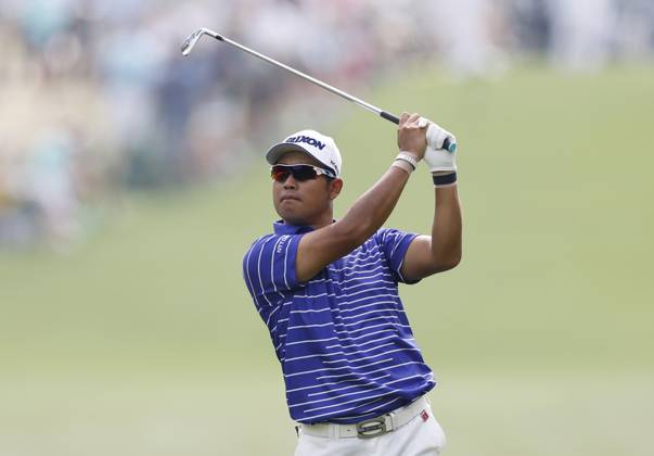 Hideki Matsuyama of Japan hit his approach shot to the first green in the first round at the Masters tournament at Augusta National Golf Club in Augusta, Georgia on Thursday, April 6, 2023.  AUG20230406022 JOHNxANGELILLO