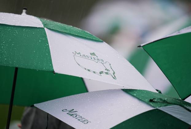 (230409) -- AUGUSTA, April 9, 2023 -- Audience watch the match in the rain during the second round of the 2023 Masters golf tournament at Augusta National Golf Club in Augusta, the United States, on April 8, 2023. ) (SP)U.S.-AUGUSTA-MASTERS-GOLF TOURNAMENT WuxXiaoling 