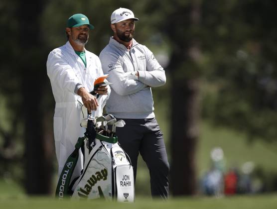 Golf, PGA, Masters Tournament in Augusta Jon Rahm of Spain studies approach shot with caddie Adam Hayes from the 1st fairway during the final round at the 87th Masters tournament at Augusta National Golf Club in Augusta, Georgia on Sunday, April 9, 2023.  AUG20230409211 JOHNxANGELILLO