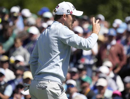 Golf, PGA, Masters Tournament in Augusta Russell Henley waves after sinking putt at the 2nd hole during the final round at the 87th Masters tournament at Augusta National Golf Club in Augusta, Georgia on Sunday, April 9, 2023.  AUG20230409220 BOBxSTRONG