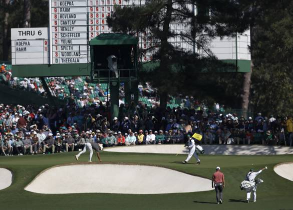 Jon Rahn (L) and Brooks Koepka arrive on the 7th green during the final round at the 87th Masters tournament at Augusta National Golf Club in Augusta, Georgia on Sunday, April 9, 2023.  AUG20230409233 JOHNxANGELILLO