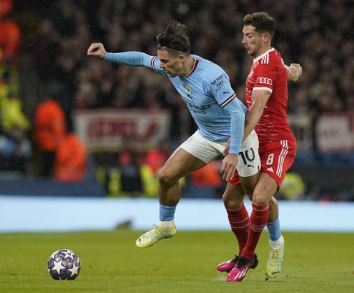 Manchester, England, 11th April 2023. Jack Grealish of Manchester City tackled by Leon Goretzka of Bayern Munich during the UEFA Champions League match at the Etihad Stadium, Manchester. Picture credit should read: Andrew Yates Sportimage EDITORIAL USE ONLY. No use with unauthorised audio, video, data, fixture lists, club league logos or live services. Online in-match use limited to 120 images, no video emulation. No use in betting, games or single club league player publications. SPI-2360-0030