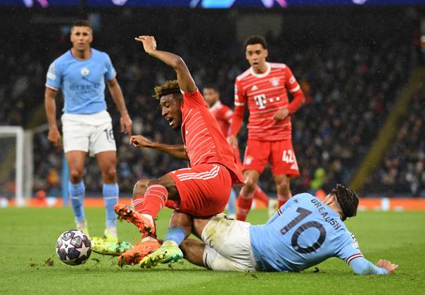 Manchester, England, 11th April 2023. Jack Grealish of Manchester City tackles Kingsley Coman of Bayern Munich during the UEFA Champions League match at the Etihad Stadium, Manchester. Picture credit should read: Gary Oakley Sportimage EDITORIAL USE ONLY. No use with unauthorised audio, video, data, fixture lists, club league logos or live services. Online in-match use limited to 120 images, no video emulation. No use in betting, games or single club league player publications. SPI-2360-0035
