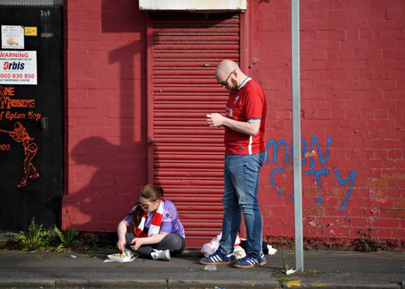 Liverpool, England, 3rd May 2023. Fans gather outside Anfield ahead of the Premier League match at Anfield, Liverpool. Picture credit should read: Gary Oakley Sportimage EDITORIAL USE ONLY. No use with unauthorised audio, video, data, fixture lists, club league logos or live services. Online in-match use limited to 120 images, no video emulation. No use in betting, games or single club league player publications. SPI-2418-0003