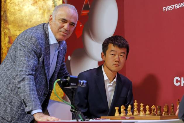 (230507) -- BUCHAREST, May 7, 2023 -- Former World Chess Champion, Garry Kasparov (L) of Russia, poses with World Chess Champion, China s Ding Liren, during the round 1 match between Ding Liren of China and Maxime Vachier-Lagrave of France at Grand Chess Tour 2023 in downtown Bucharest, capital of Romania, May 6, 2023. (Photos by Xinhua) (SP)ROMANIA-BUCHAREST-CHESS-GRAND TOUR CristianxCristel