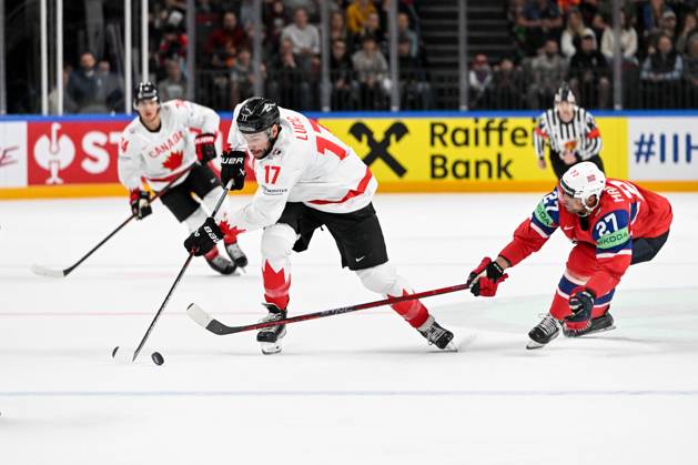 RIGA, LATVIA MAY 22 Milan Lucic of Canada defends the puck against Andreas Martinsen of Norway during the 2023 IIHF Ice Hockey World Championship Finland Latvia game between Canada and Norway at Arena Riga on May 22, 2023 in Riga, Latvia Riga Arena Riga Latvia  Copyright: xJustPictures.ch AndreaxBrancax