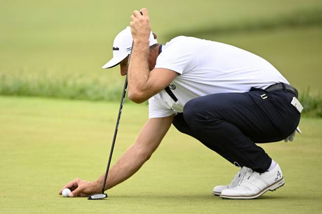 Dustin Johnson places his ball on the 17th green during the first round of the 2023 U.S. Open at the Los Angeles Country Club in Los Angeles on Thursday, June 15, 2023. McIlroy finished with a five-under par 65.  LAP20230615234 ALEXxGALLARDO