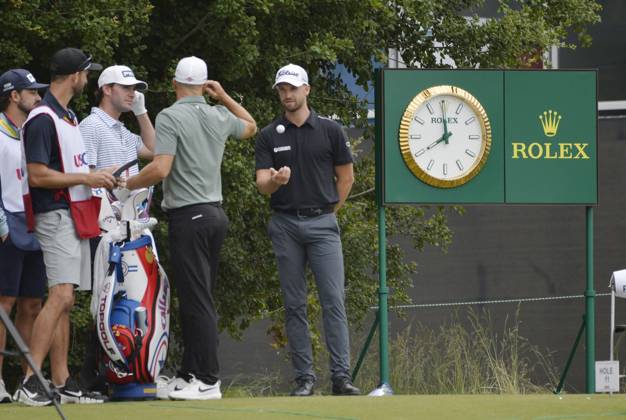Wyndham Clark (C) talks with other players at the 11th tee during the second round of the 2023 U.S. Open Golf Championship at the Los Angeles Country Club in Los Angeles, California on Friday, June 16, 2023.  LAP20230616910 MIKExGOULDING