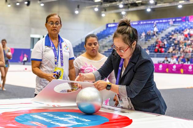 June 18, 2023, Berlin, Germany: An olympic officer with down syndrome provides equipment check of an athlete after competition in Rhythmic gymnastics, Rhythmische Sportgymnastik, RSG discipline during the Special Olympics Summer World Games Berlin 2023 in Messe conference centre. The 2023 Berlin Games will host 7000 athletes with learning disabilities from 190 countries. Special Olympics is an international charity which aims to include individuals with learning disabilities into the realm of olympic sports. Berlin 2023 is the biggest sporting as well as charitable event of 2023. Berlin Germany - ZUMAs197 20230618_zaa_s197_129 Copyright: xDominikaxZarzyckax